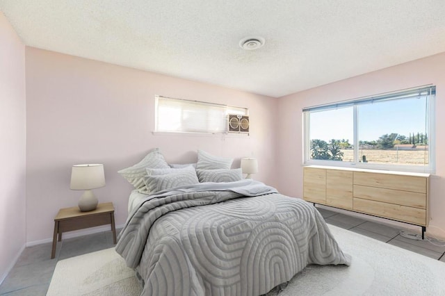 bedroom featuring light tile patterned floors