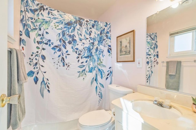 bathroom featuring toilet and vanity