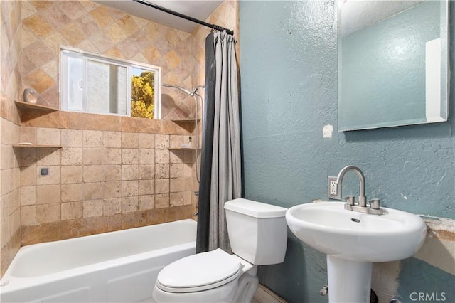 full bathroom with toilet, sink, and shower / bath combo