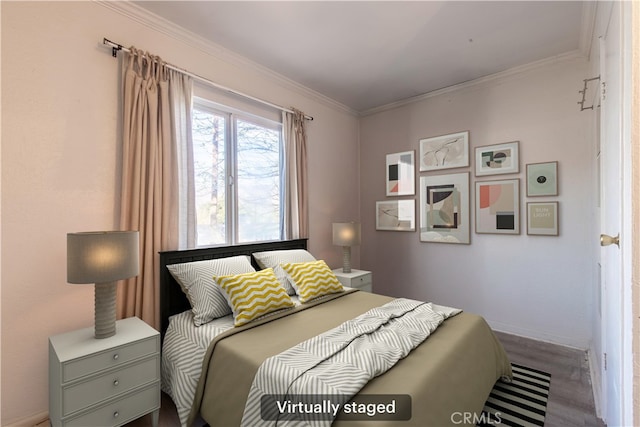 bedroom with crown molding and hardwood / wood-style floors