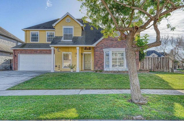 view of front of home with a front lawn and a garage