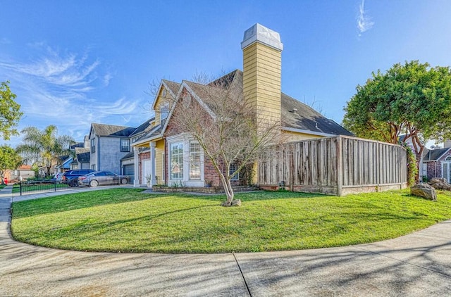 view of property exterior featuring a yard and a garage