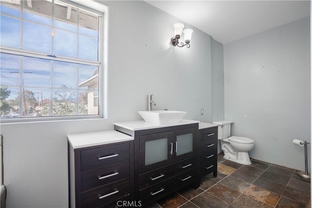 bathroom with toilet and vanity