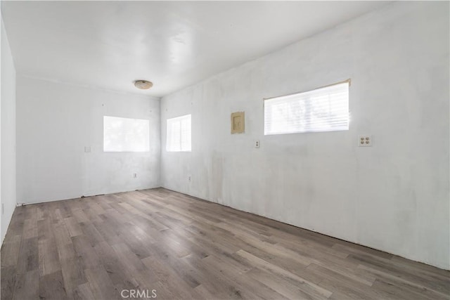 spare room with hardwood / wood-style flooring