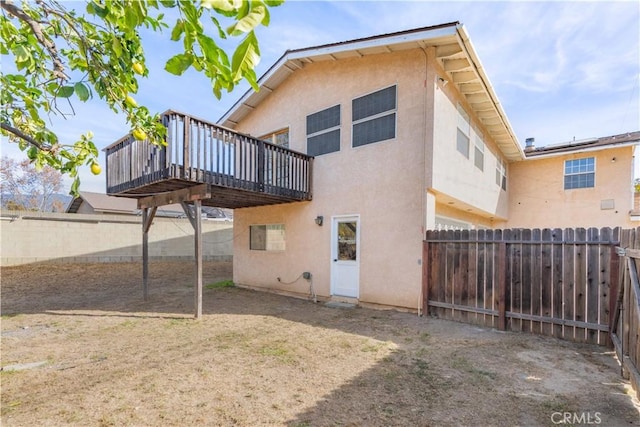 rear view of property with a deck