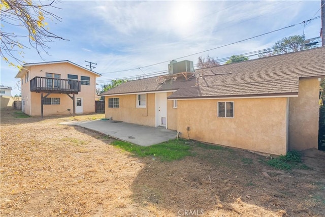 back of house with a patio area and a balcony