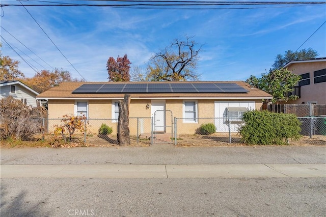 view of front of home with solar panels