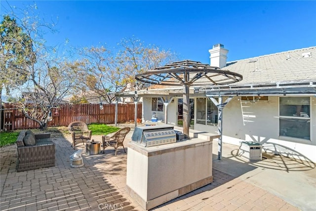 view of patio featuring an outdoor living space with a fire pit and area for grilling