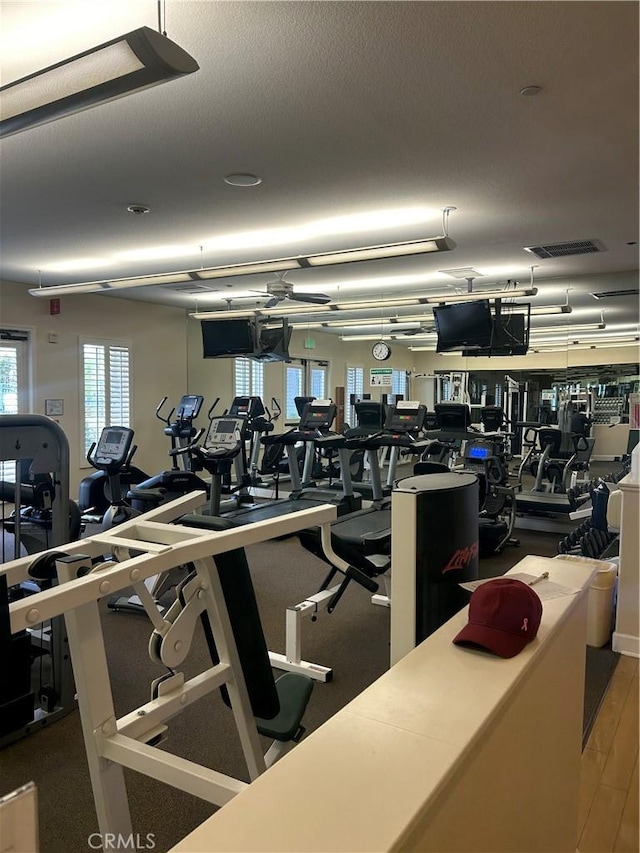 workout area with wood-type flooring