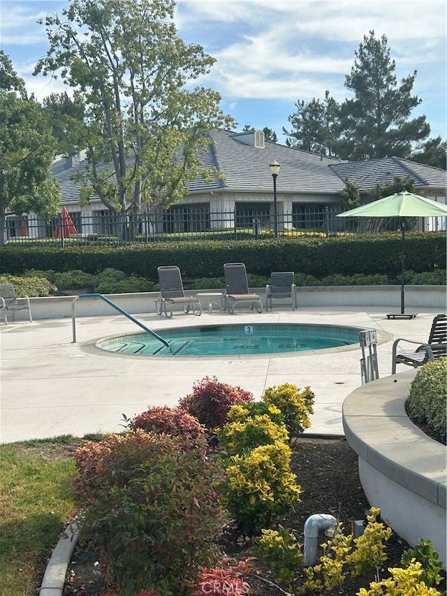 view of swimming pool featuring a patio area