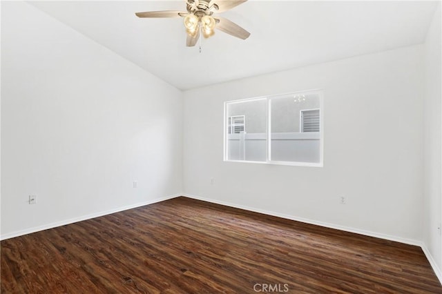 spare room featuring ceiling fan and dark hardwood / wood-style flooring