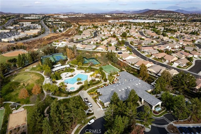 birds eye view of property with a mountain view