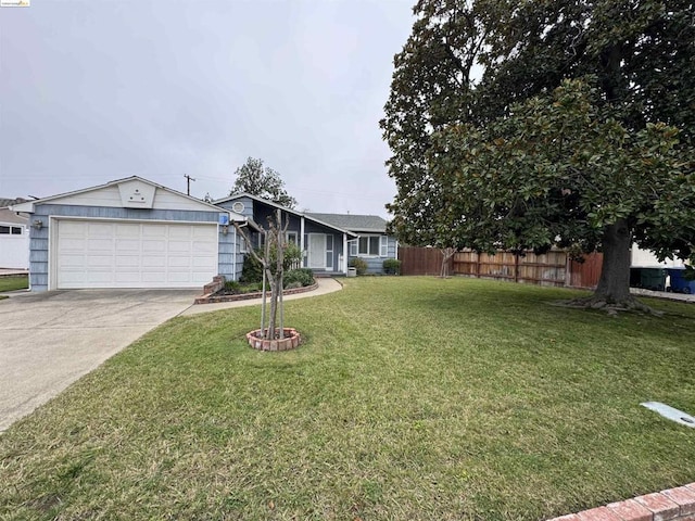 view of front of property featuring a garage and a front lawn