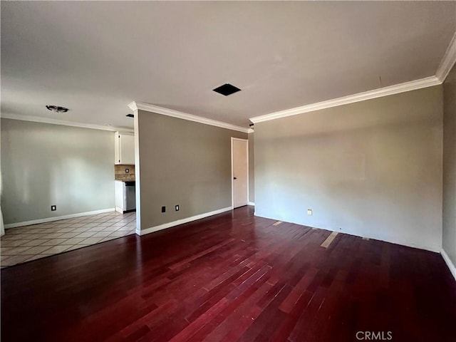 empty room featuring crown molding and hardwood / wood-style floors