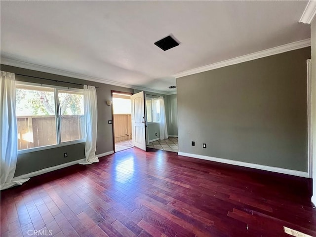 unfurnished room with hardwood / wood-style floors and crown molding