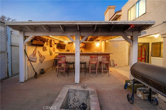 patio terrace at dusk with an outdoor bar