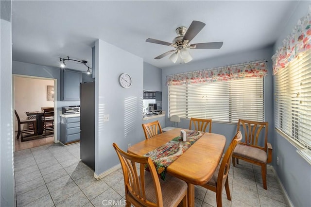 dining room with light tile patterned floors, ceiling fan, and a wealth of natural light