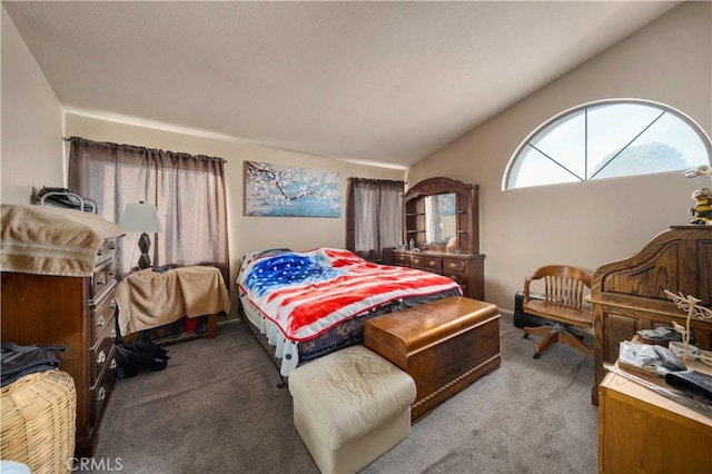 carpeted bedroom with vaulted ceiling