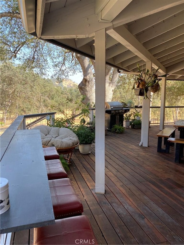 wooden deck with grilling area