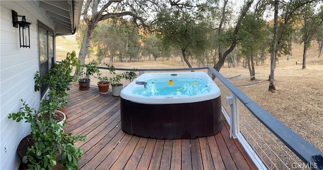 wooden terrace with a hot tub