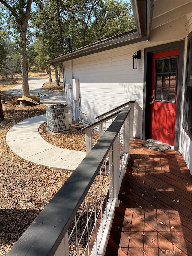 wooden deck with central AC unit