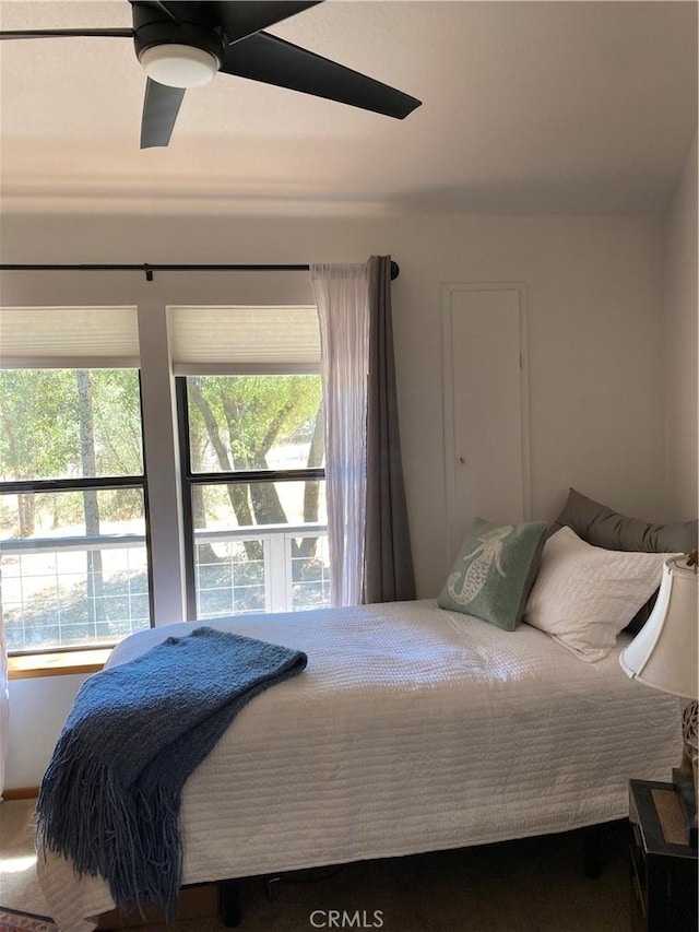 bedroom featuring ceiling fan