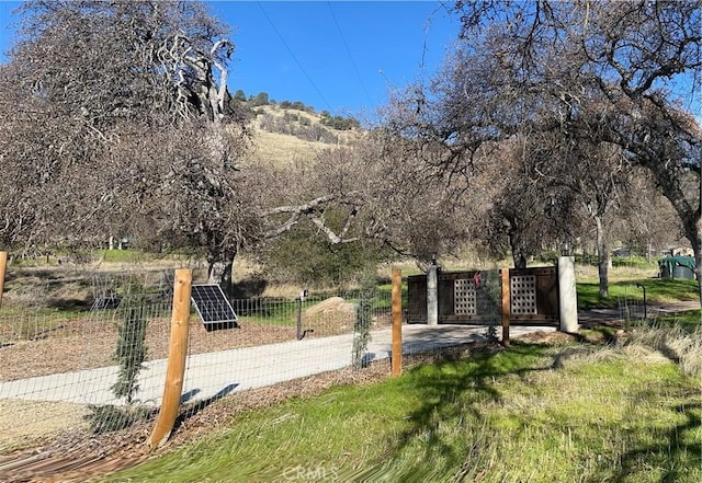 view of community with fence