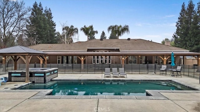 view of swimming pool with an in ground hot tub, a gazebo, and a patio