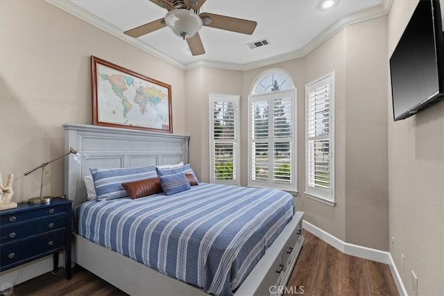 bedroom featuring ceiling fan, crown molding, and dark hardwood / wood-style floors