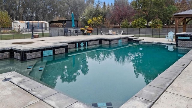 view of pool featuring a patio area and a gazebo