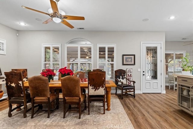 dining room featuring hardwood / wood-style flooring and ceiling fan