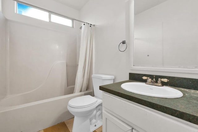 full bathroom featuring vanity, shower / tub combo, and toilet