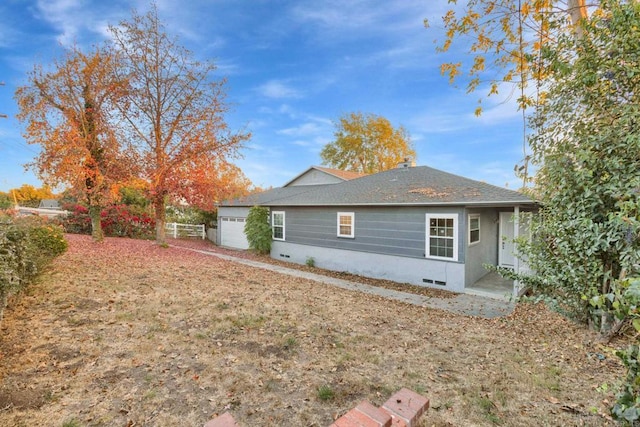 view of side of home with a garage