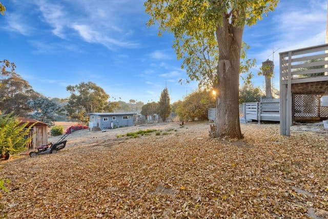 view of yard featuring a wooden deck