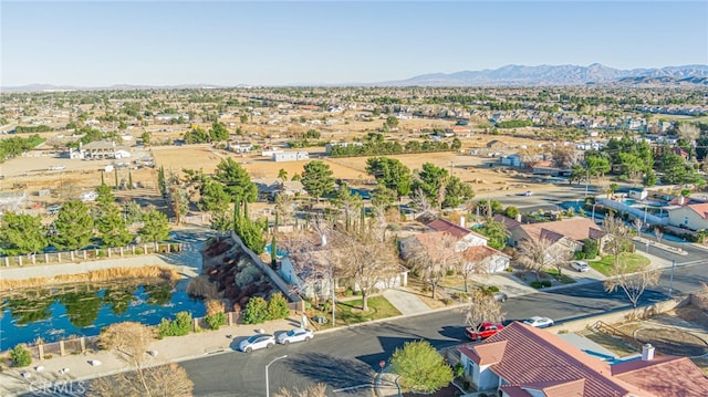 birds eye view of property featuring a mountain view