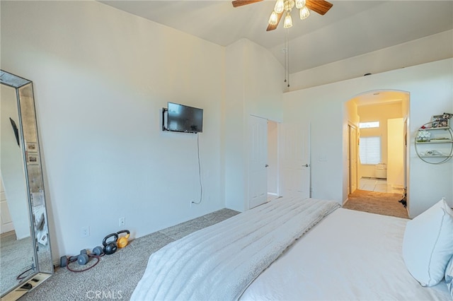 carpeted bedroom featuring ceiling fan and lofted ceiling