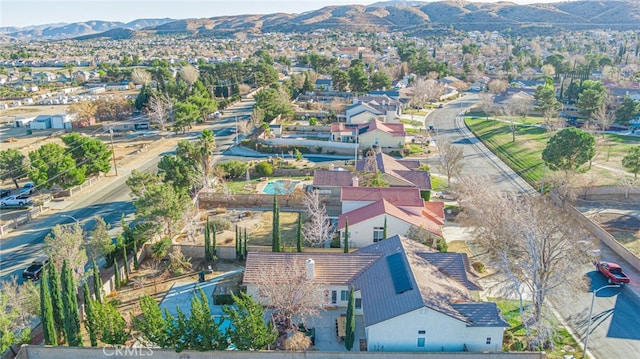 birds eye view of property with a mountain view