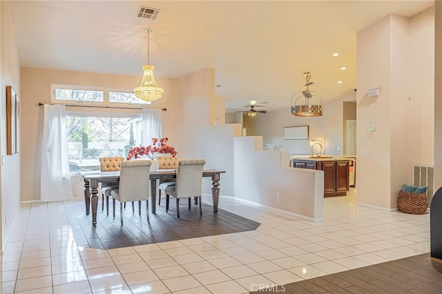 tiled dining area featuring sink