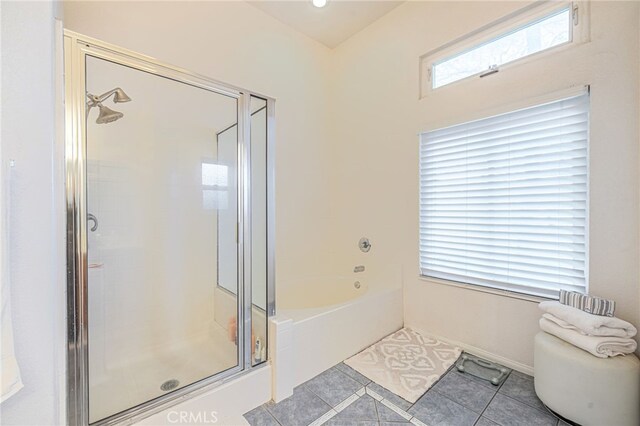 bathroom featuring separate shower and tub and tile patterned flooring