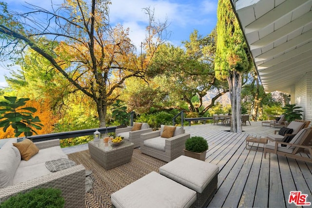 wooden deck featuring an outdoor hangout area