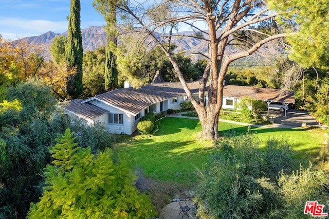 birds eye view of property with a mountain view