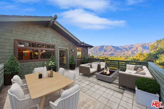 view of patio / terrace featuring outdoor lounge area and a mountain view