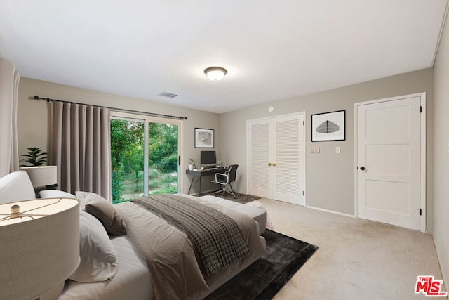 bedroom featuring light colored carpet and access to exterior