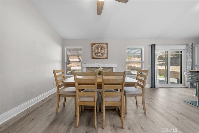 dining area featuring ceiling fan and light wood-type flooring