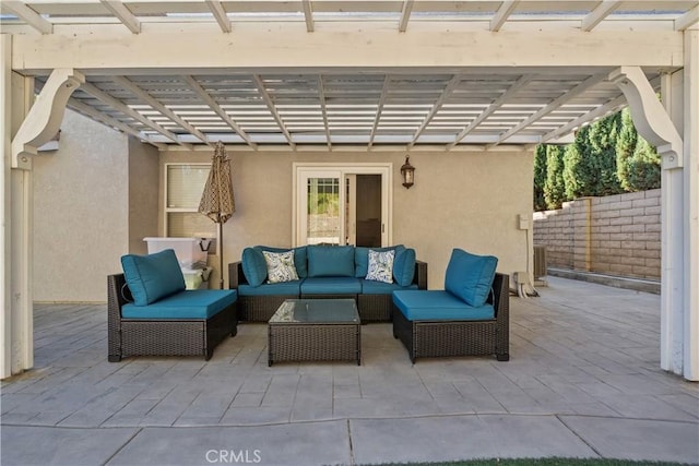 view of patio / terrace with an outdoor living space and a pergola