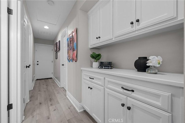 corridor featuring light hardwood / wood-style floors