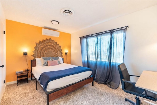 bedroom with carpet floors and an AC wall unit