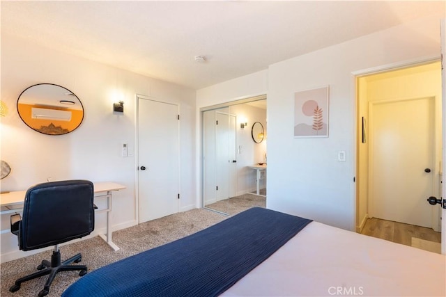 bedroom featuring light colored carpet and a closet