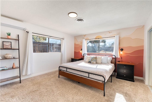 carpeted bedroom with a wall unit AC and multiple windows