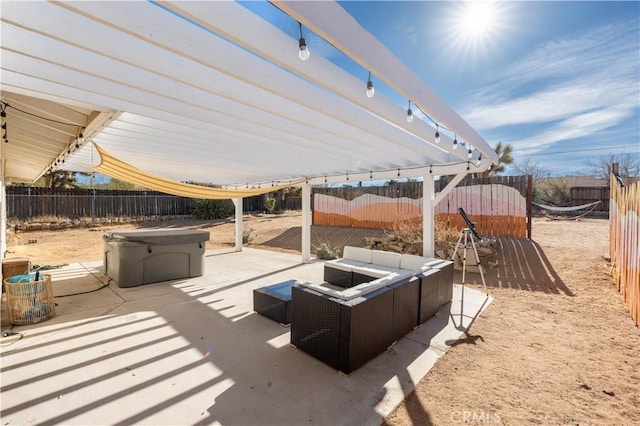 view of patio / terrace with a hot tub